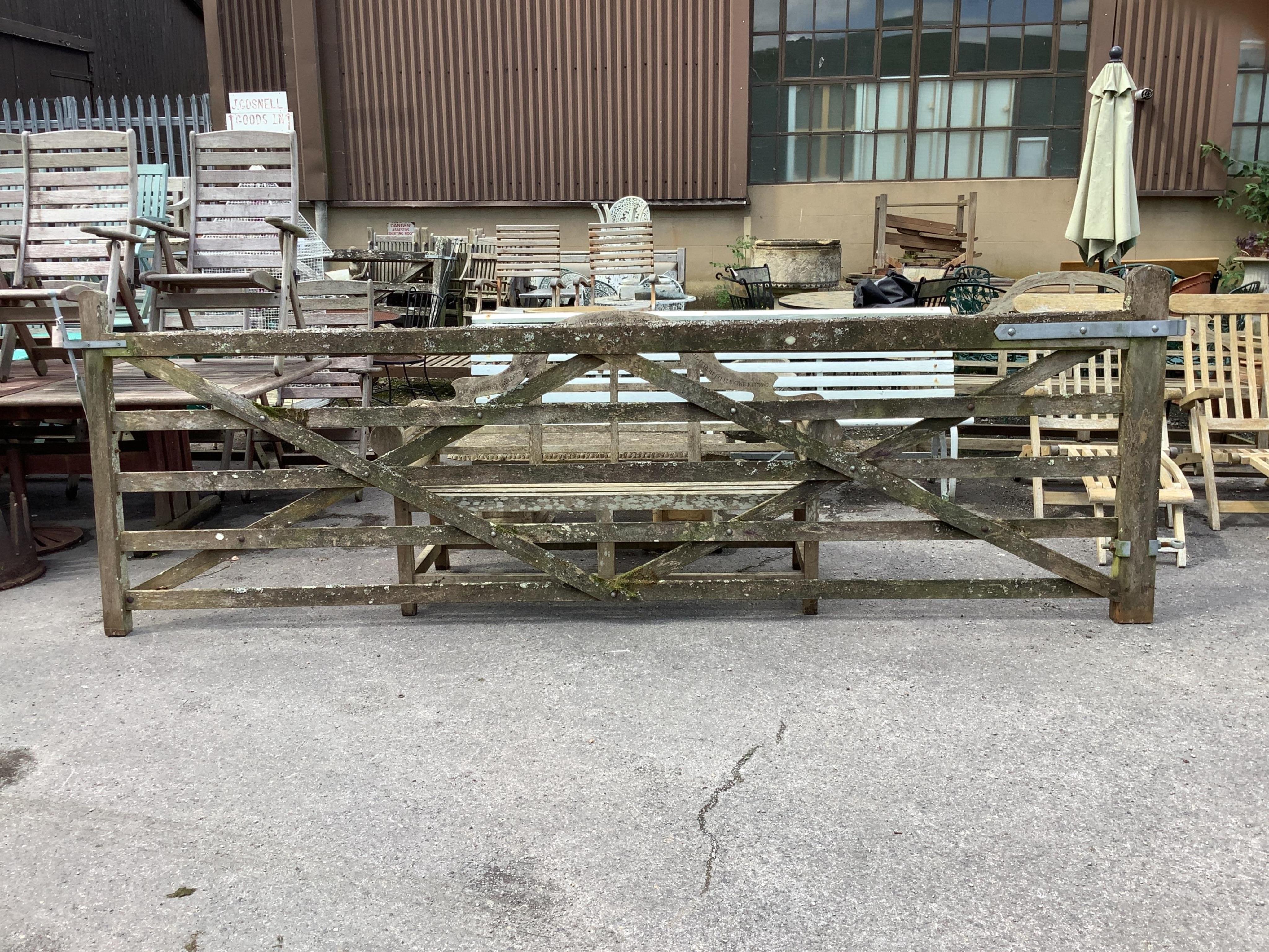 A pair of 12ft Biddenden hardwood gates with galvanised mounts. Condition - poor to fair